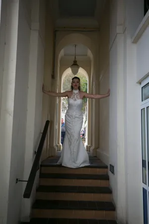 Elegant fishtail dress with sweetheart neckline & halterneck embroidery